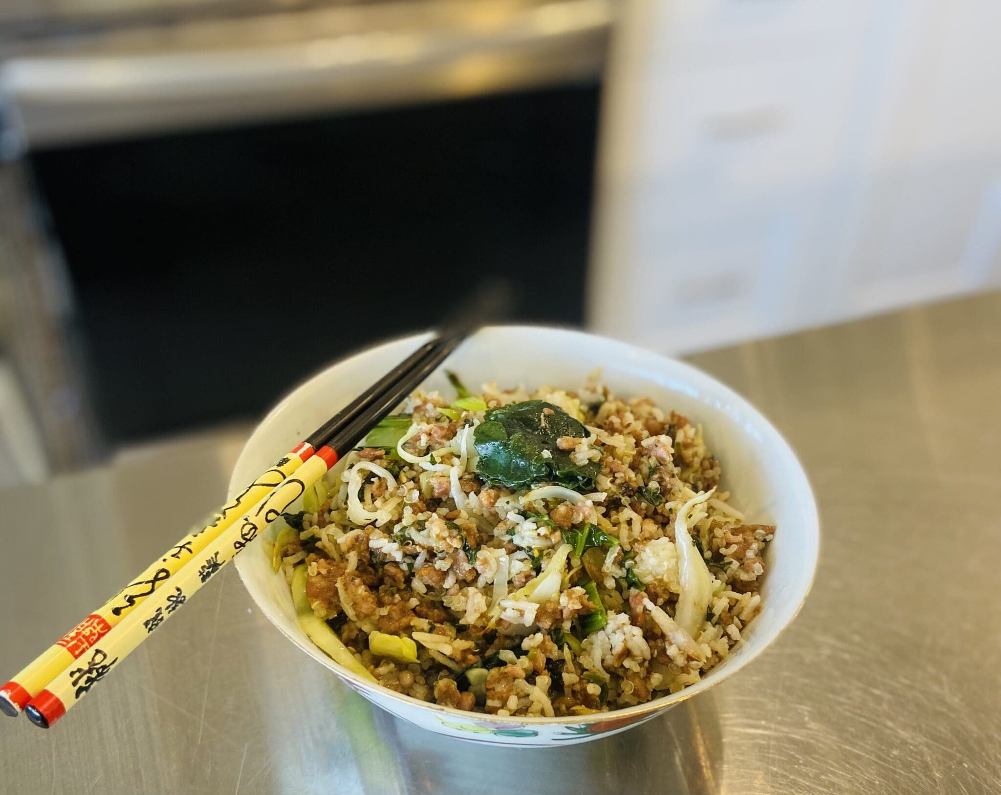 Bowl of minced pork rice with chopsticks